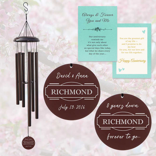 Personalized wind chime for couples with custom engraved names and anniversary date hanging in a peaceful garden, ideal for weddings, anniversaries, and romantic gifts.