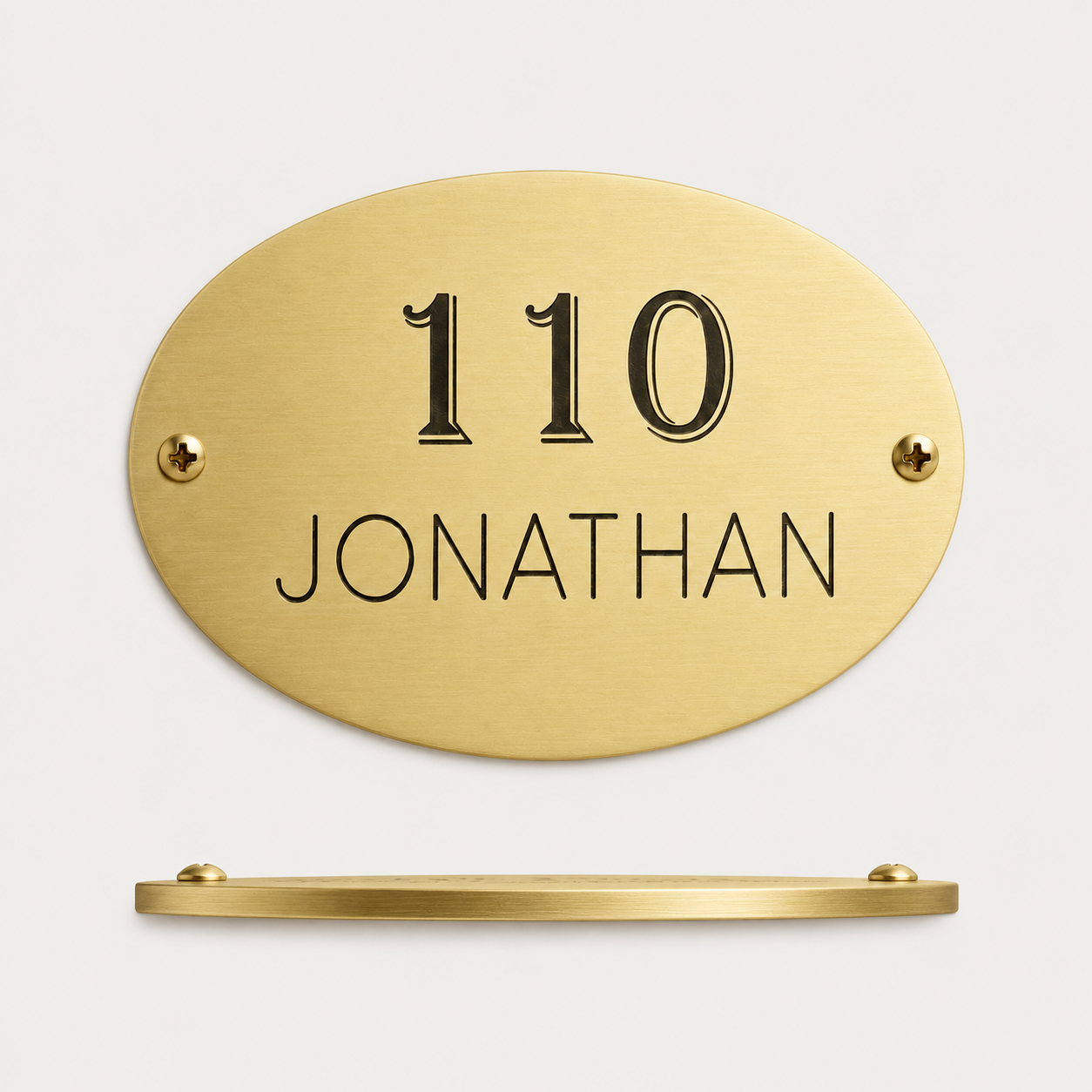 Oval brass plaque with custom engraved name and message