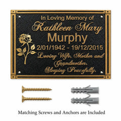 Personalized brass memorial plaque shown with matching screws and wall anchors on a clean background.
