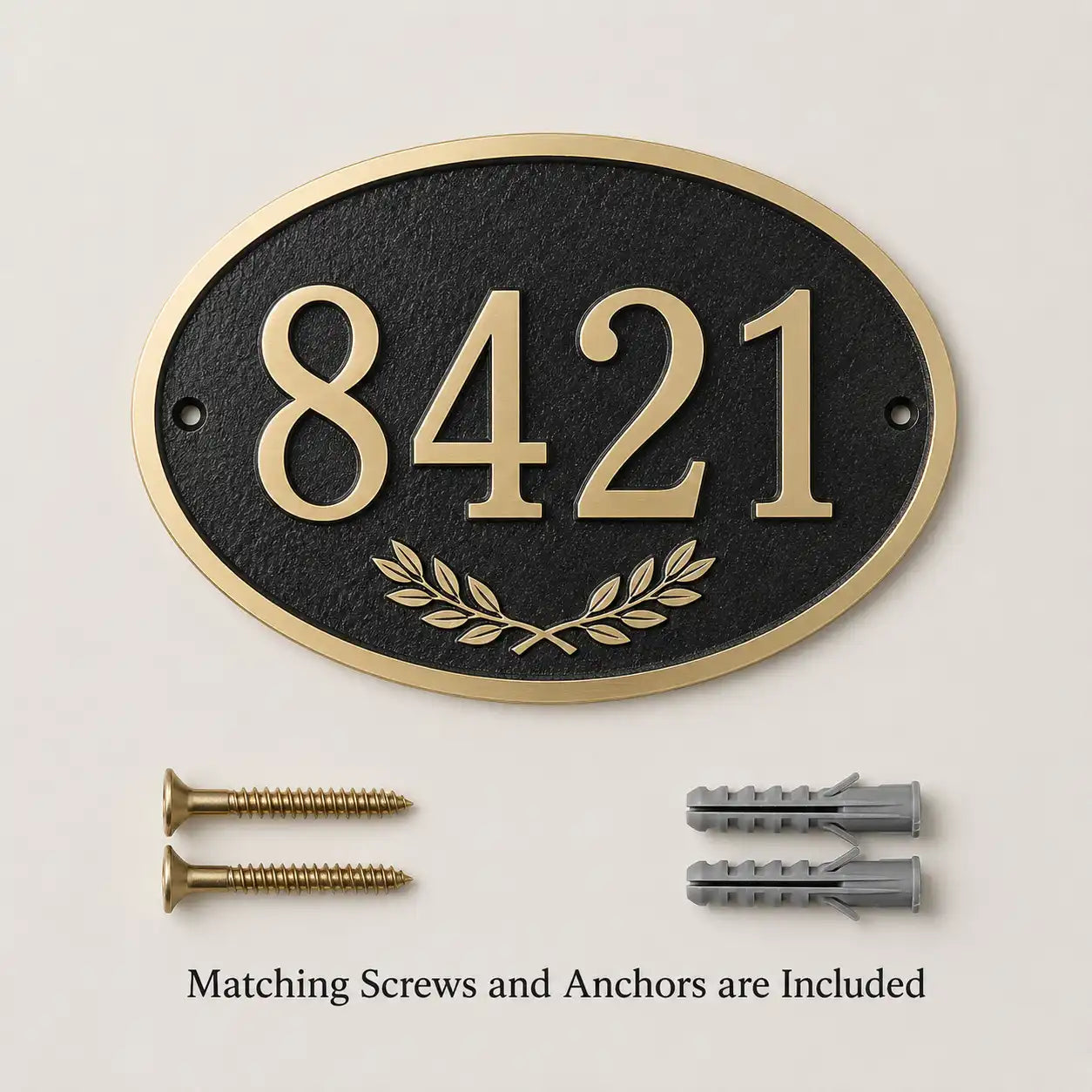 Custom oval brass house number sign displayed with two mounting screws and two wall anchors included