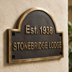 Personalized bronze house address plaque featuring an elegant antique finish