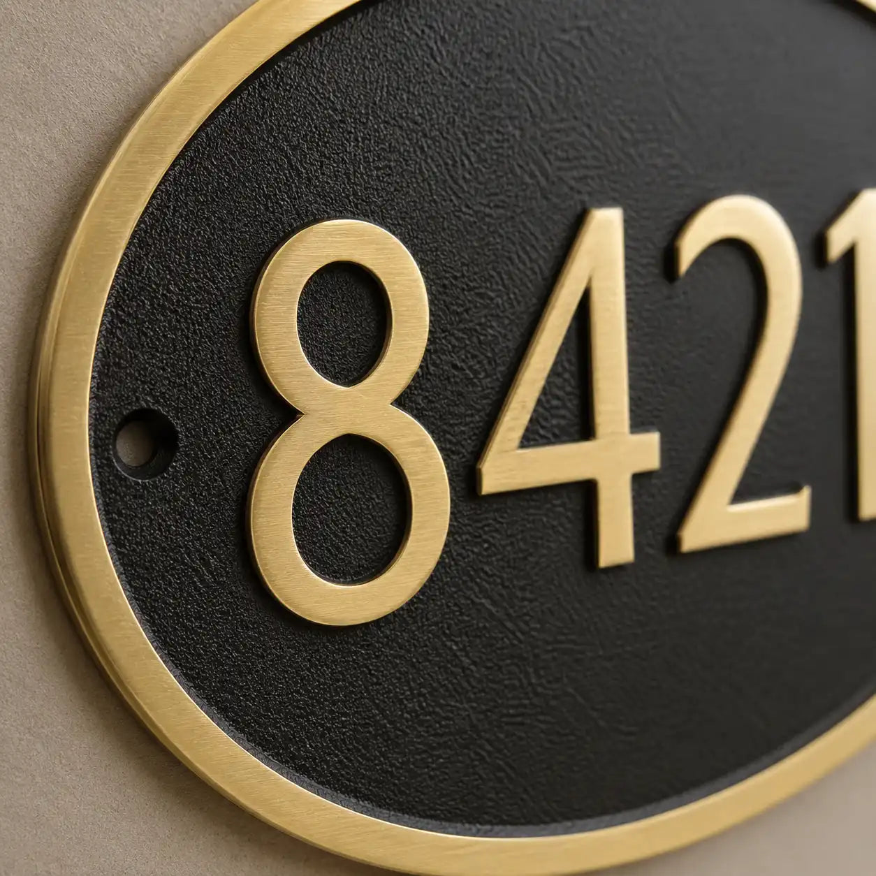 Custom engraved oval brass door sign with house number