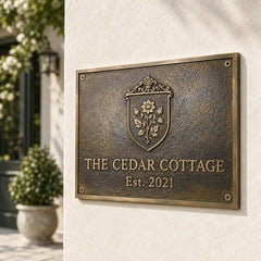 Custom brass nameplate with house number, polished lettering and classic border.
