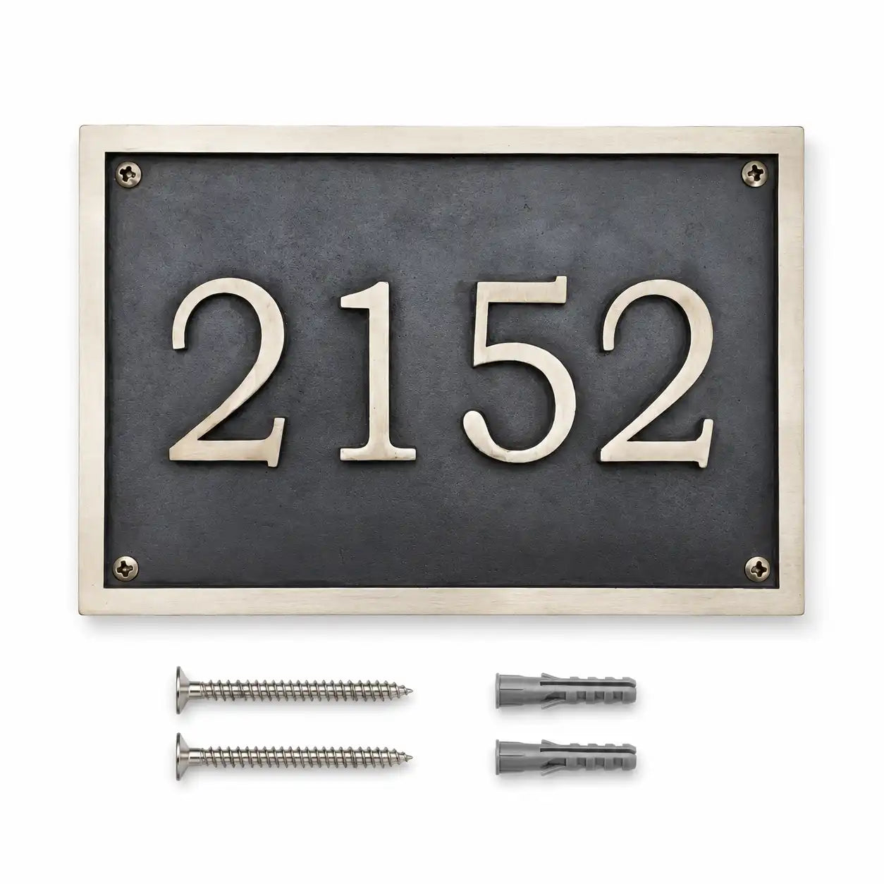 Custom brass address plaque displayed with two mounting screws and two wall anchors included for secure and easy installation.