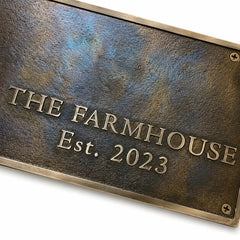 Custom brass wall plaque with engraved address information