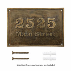 Oval brass house number sign with personalized address details