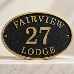 Personalized bronze oval address sign with engraved family name
