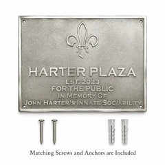 Custom Bronze Memorial Plaque displayed alongside included mounting hardware for secure wall installation.