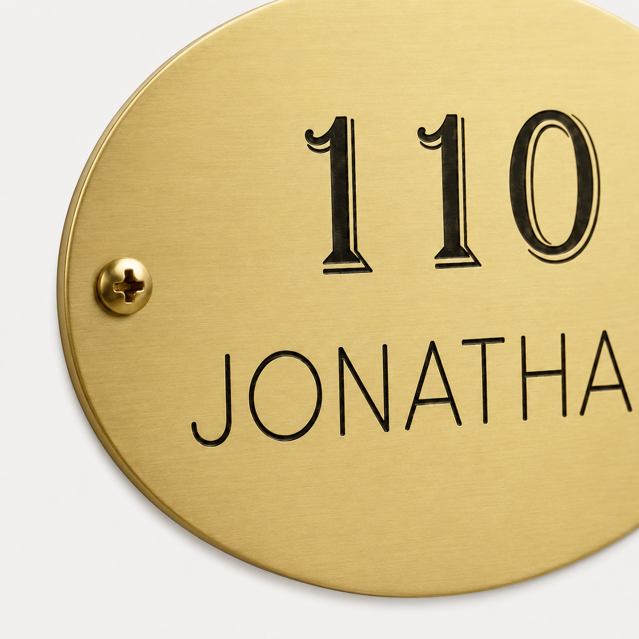 Custom oval brass plaque with engraved text