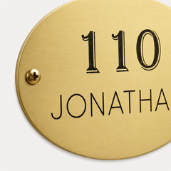Custom oval brass plaque with engraved text