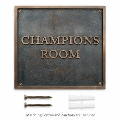 The premium bronze address plaque is shown with included fixing screws and wall anchors.