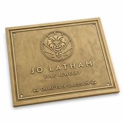Custom brass address plaque with engraved name, street address, and house number