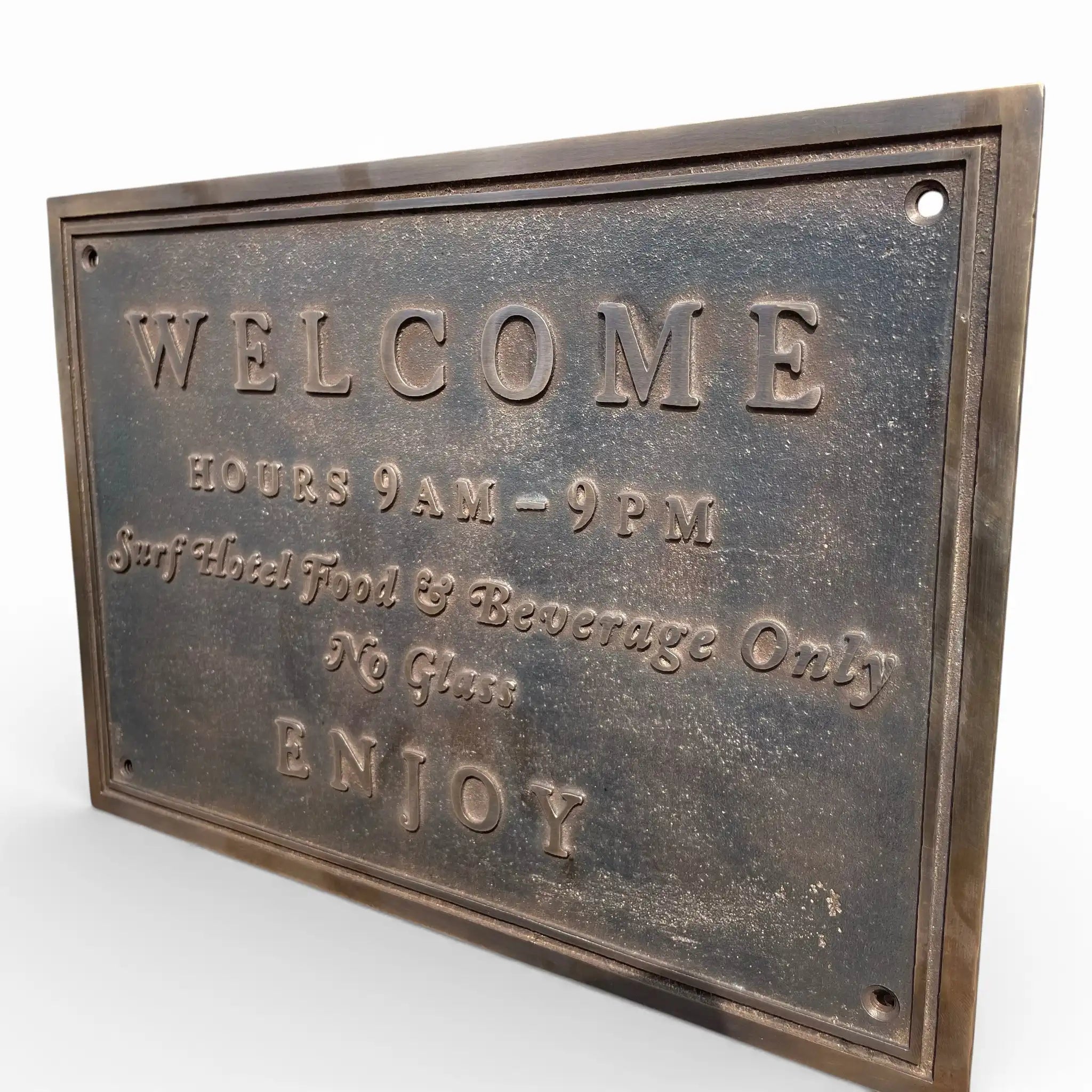 Bronze plaque with engraved text on a white background