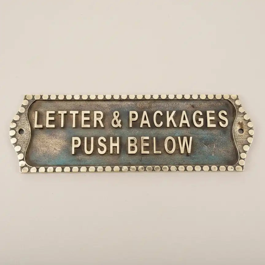 Custom Brass Name Plate for Door – Antique Finish | Decorative metal sign with text 'Letter & Packages Push Below' on a beige background