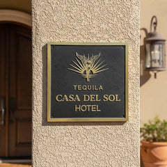 Custom Engraved Plaque on a textured wall.