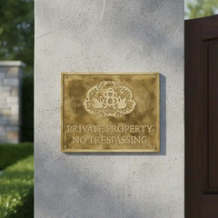 Custom Brass Plaque  - 'Private Property No Trespassing' sign on a concrete wall.