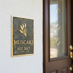 Custom plaques with logo and name on a home exterior