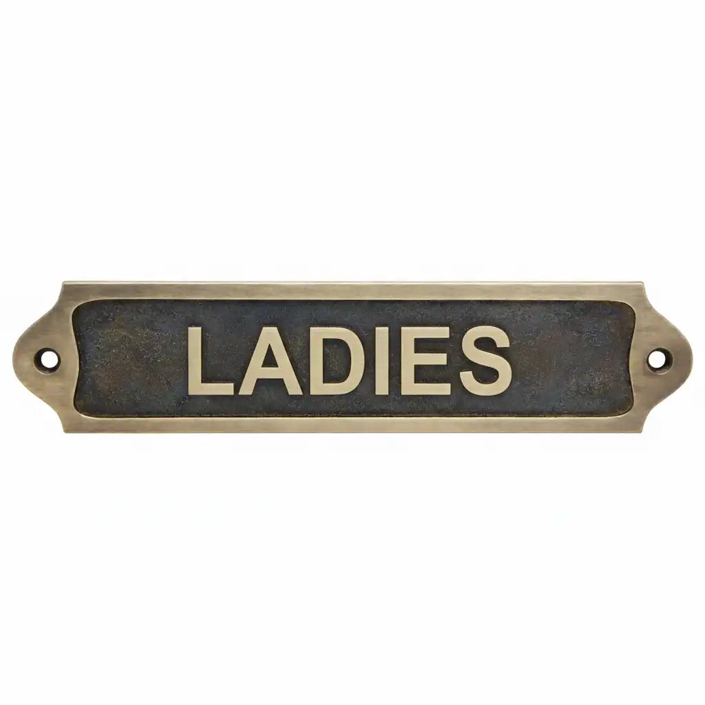Brass door sign with 'LADIES' text antique on a white background