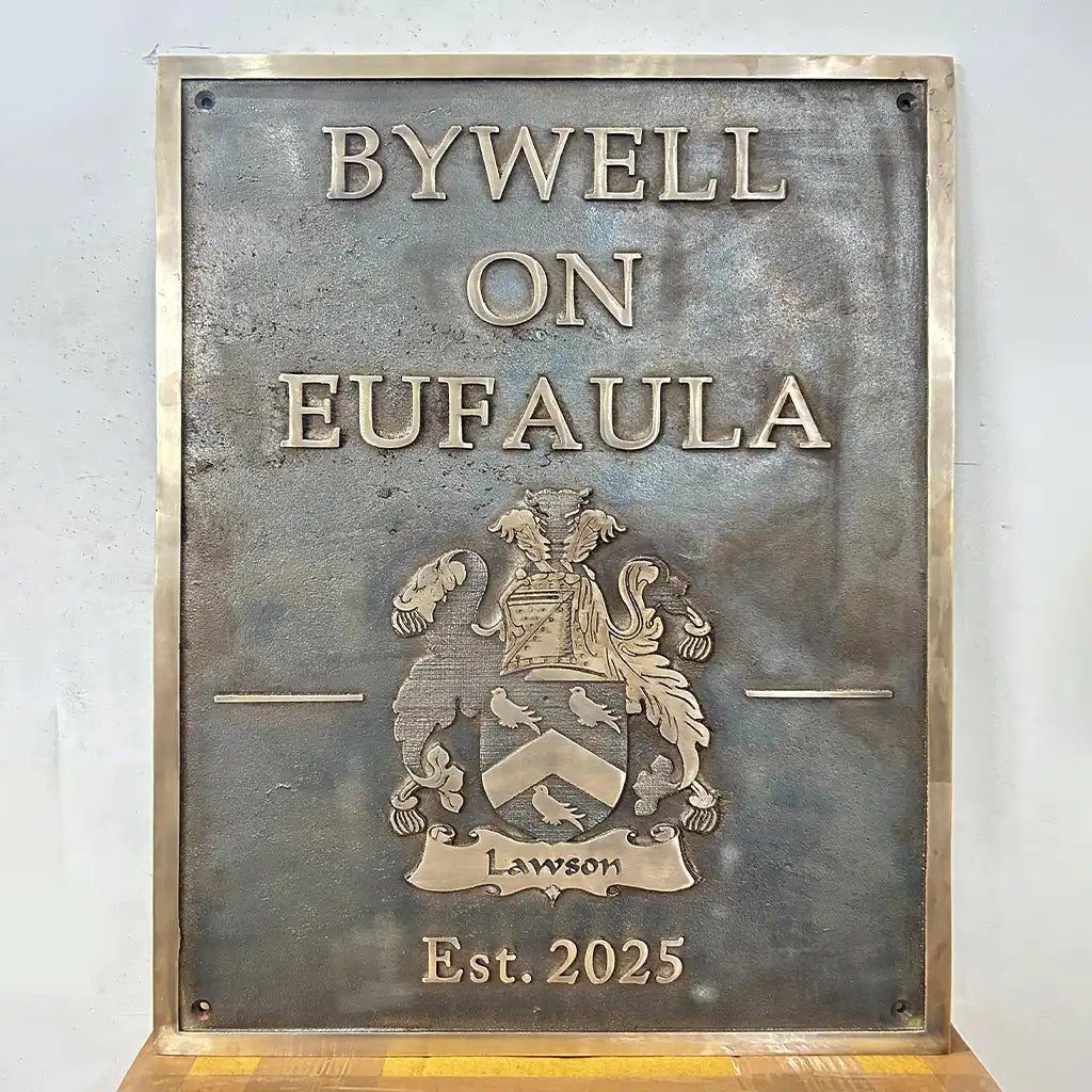 Brass Address Plaque | antique bronze plaque design with 'BYWELL ON EUFAULA' and crest on a light gray background