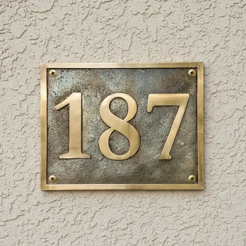 Antique Brass Address Plaque – Custom Home Number Plate on a textured wall