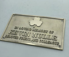 Memorial plaque for Kevin Nulle with a shamrock symbol on a light gray background