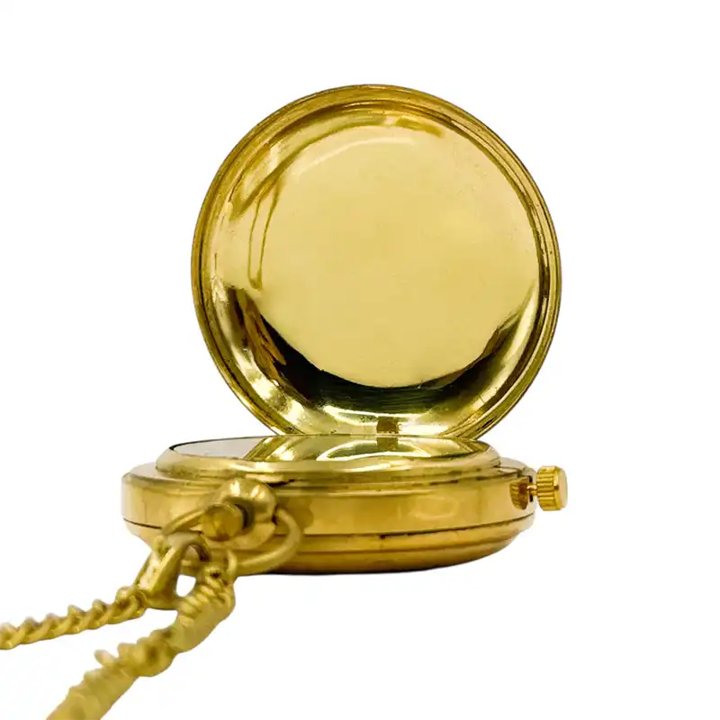 Gold pocket watch on a white background