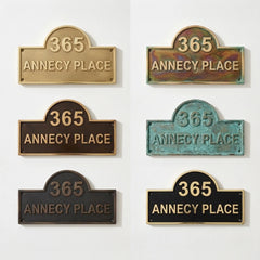 Set of six '365 Annecy Place' signs in different finishes on a white background