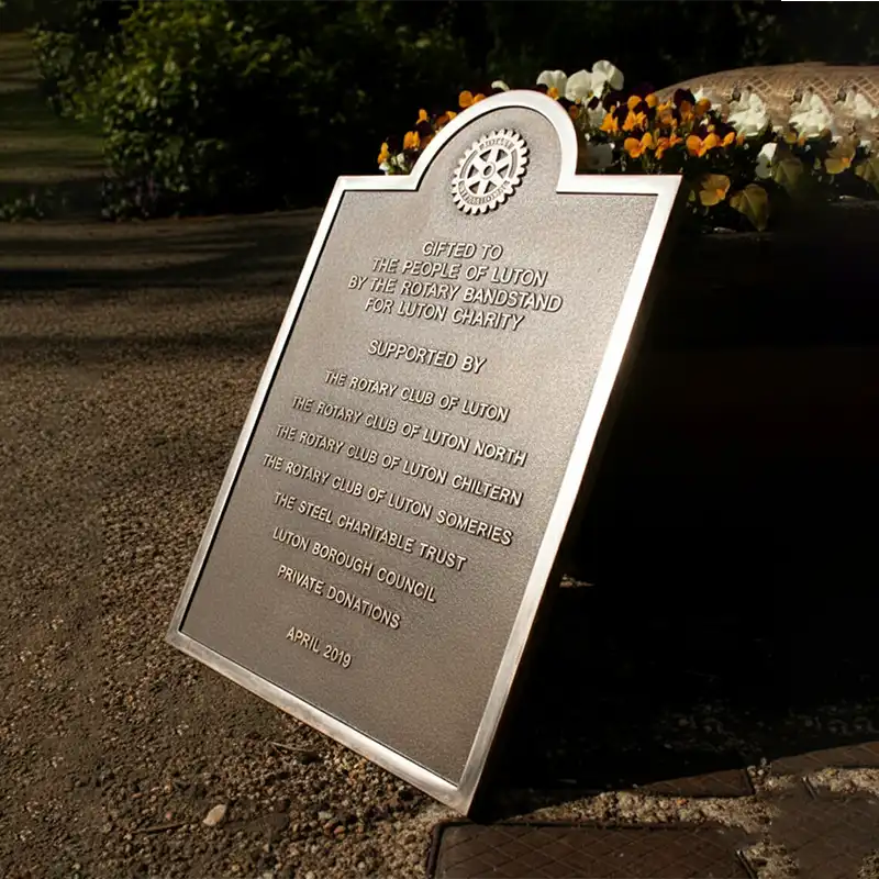 Plaque with engraved text on a stone surface