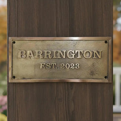 Bronze plaque on a wooden post,
Bronze name plates