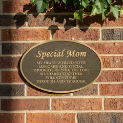 Bronze memorial plaque for remembrance with 'Special Mom' message on a brick wall
