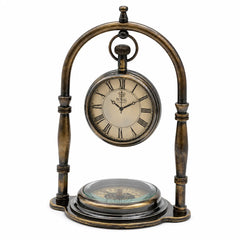 Angled front view of personalized antique brass desk clock with Roman numeral dial and compass base