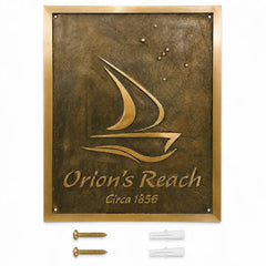 Custom brass address plaque displayed with two mounting screws and two wall anchors included for secure and easy installation.