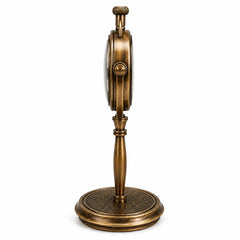 Side view of brass desk clock.