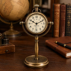 Vintage brass desk clock in classic study