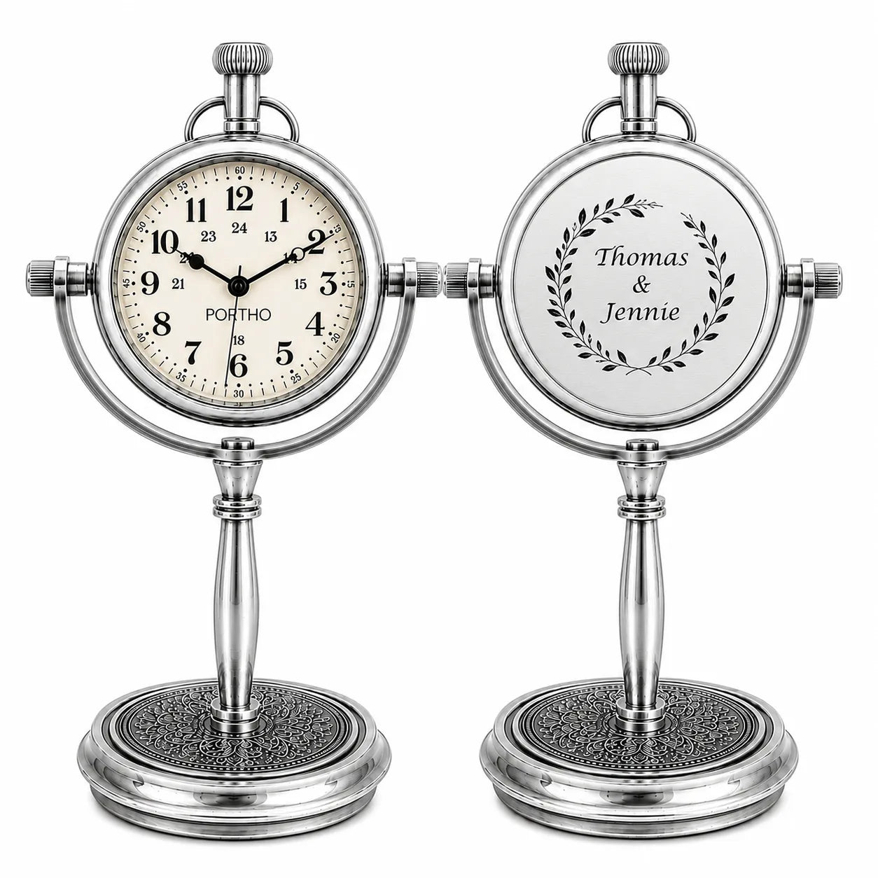 Two silver desk clocks on a white background, one showing the analog face with 'PORTHO' on the dial and the other showing the back with a personalized nameplate reading 'Thomas & Jennie' inside a leaf wreath.