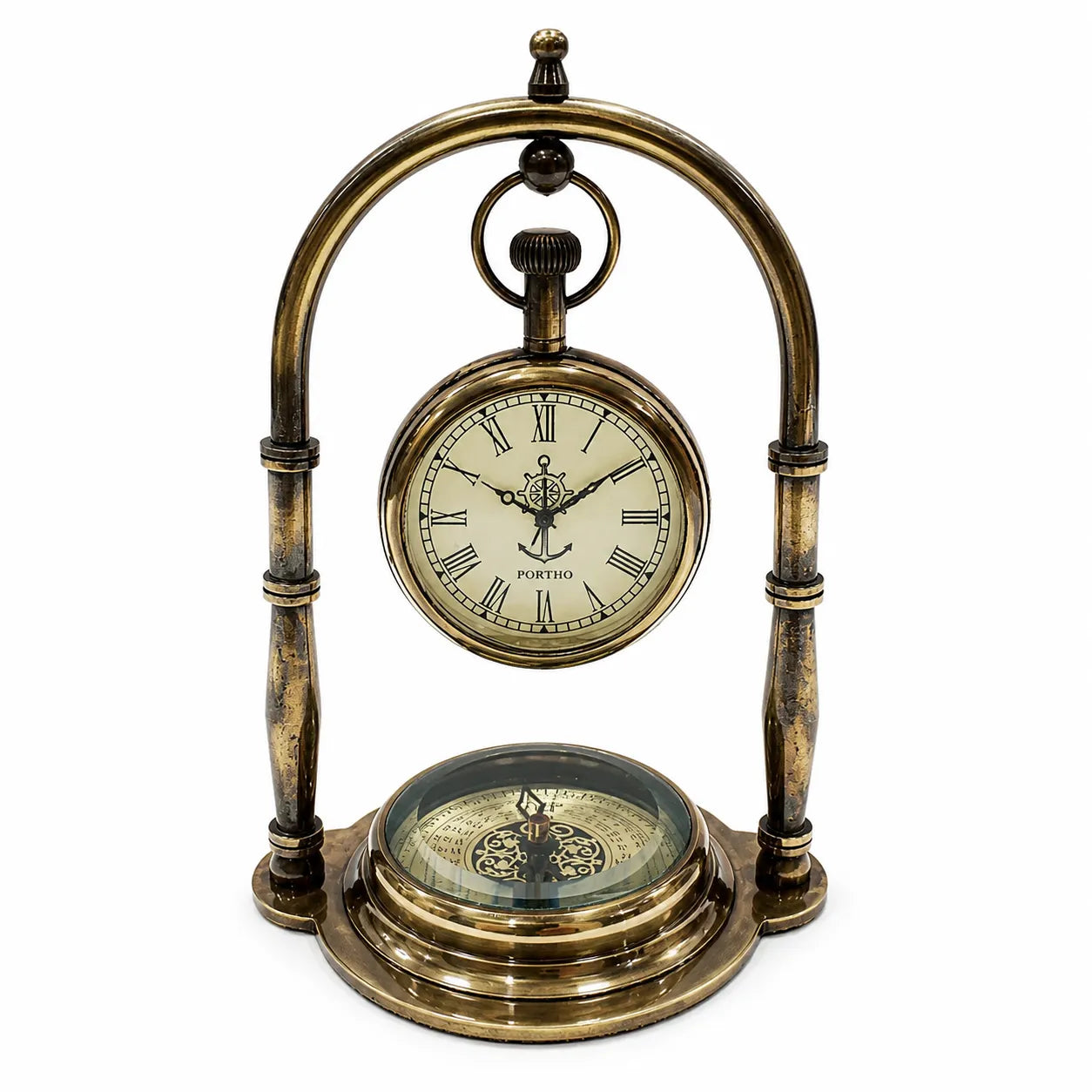 A vintage-style brass nautical clock and compass table decoration with a circular clock face, Roman numerals, and a compass rose on a glass cover, set against a plain white background.