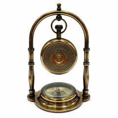 An antique brass nautical compass on a decorative stand, featuring a circular compass at the top with 'NAVY LONDON 1870' and a smaller compass base, set against a plain white background.