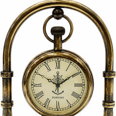 An antique-style nautical desk clock with a bronze-finished metal frame and a round cream-colored dial featuring Roman numerals, an anchor and compass design, and the brand name 'PORTHO'.