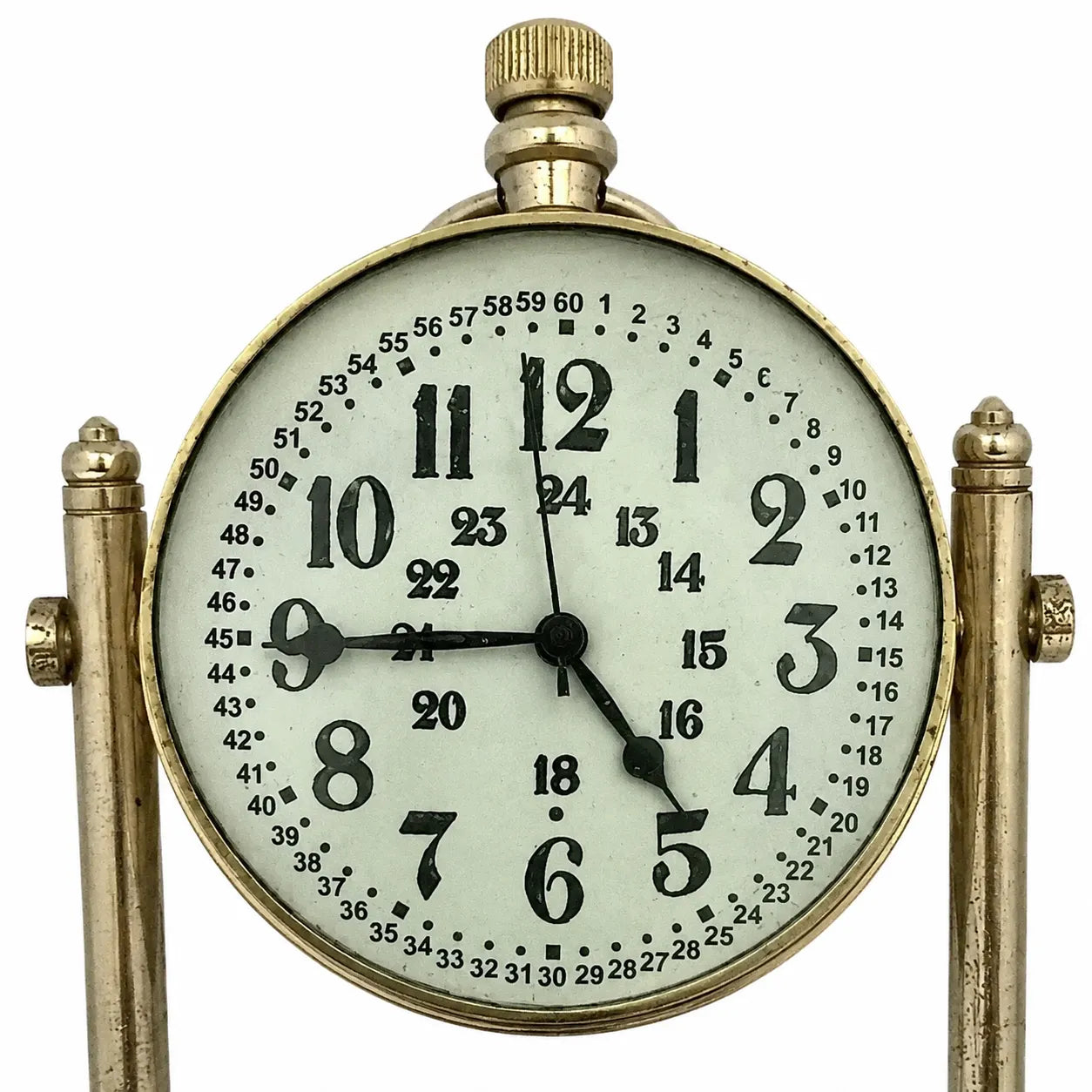 A vintage-style brass mantel clock with a round white dial, black Arabic numerals, and black hands, supported by two ornate brass posts on a white background.