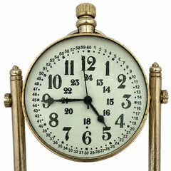 A vintage-style brass mantel clock with a round white dial, black Arabic numerals, and black hands, supported by two ornate brass posts on a white background.
