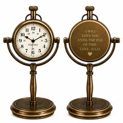 Two antique-style bronze desk clocks on a white background, one showing the front with a white dial and black numerals, and the other showing the back with a personalized inscription.