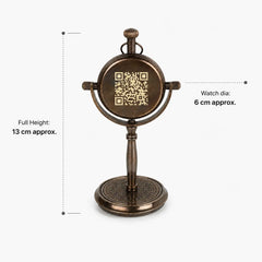 An antique bronze tabletop mirror with a circular watch face design and a QR code in the center, shown with dimension annotations indicating a full height of 13 cm and a watch diameter of 6 cm.