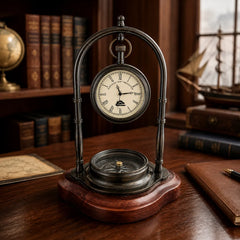 Antique brass desk clock with compass displayed in nautical home office