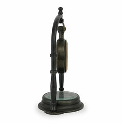 Side profile of antique brass hanging desk clock with compass base