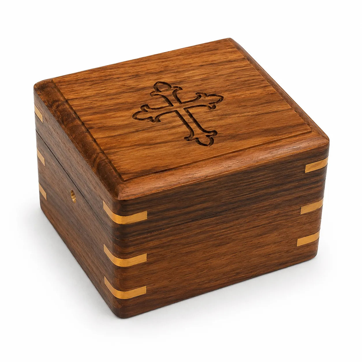 Closed wooden compass box with brass corner accents and engraved cross design