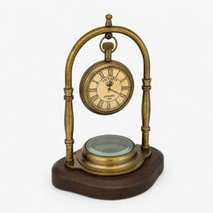 Angled front view of Victoria London brass desk clock with compass