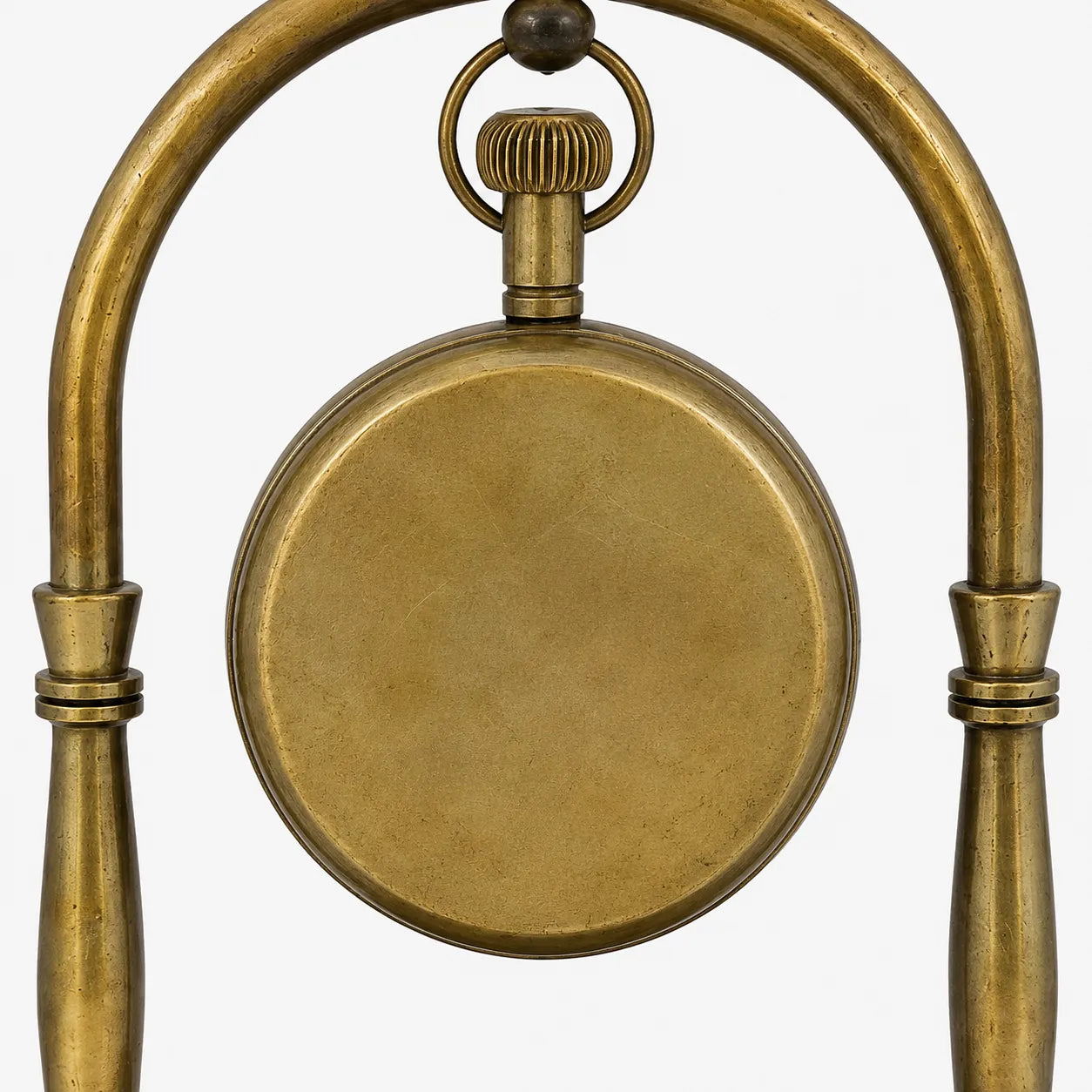 Close-up of plain smooth brass back on Victoria London desk clock