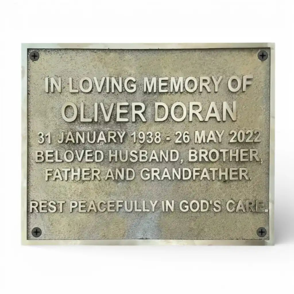 Memorial plaque for with birth and death dates on a white background