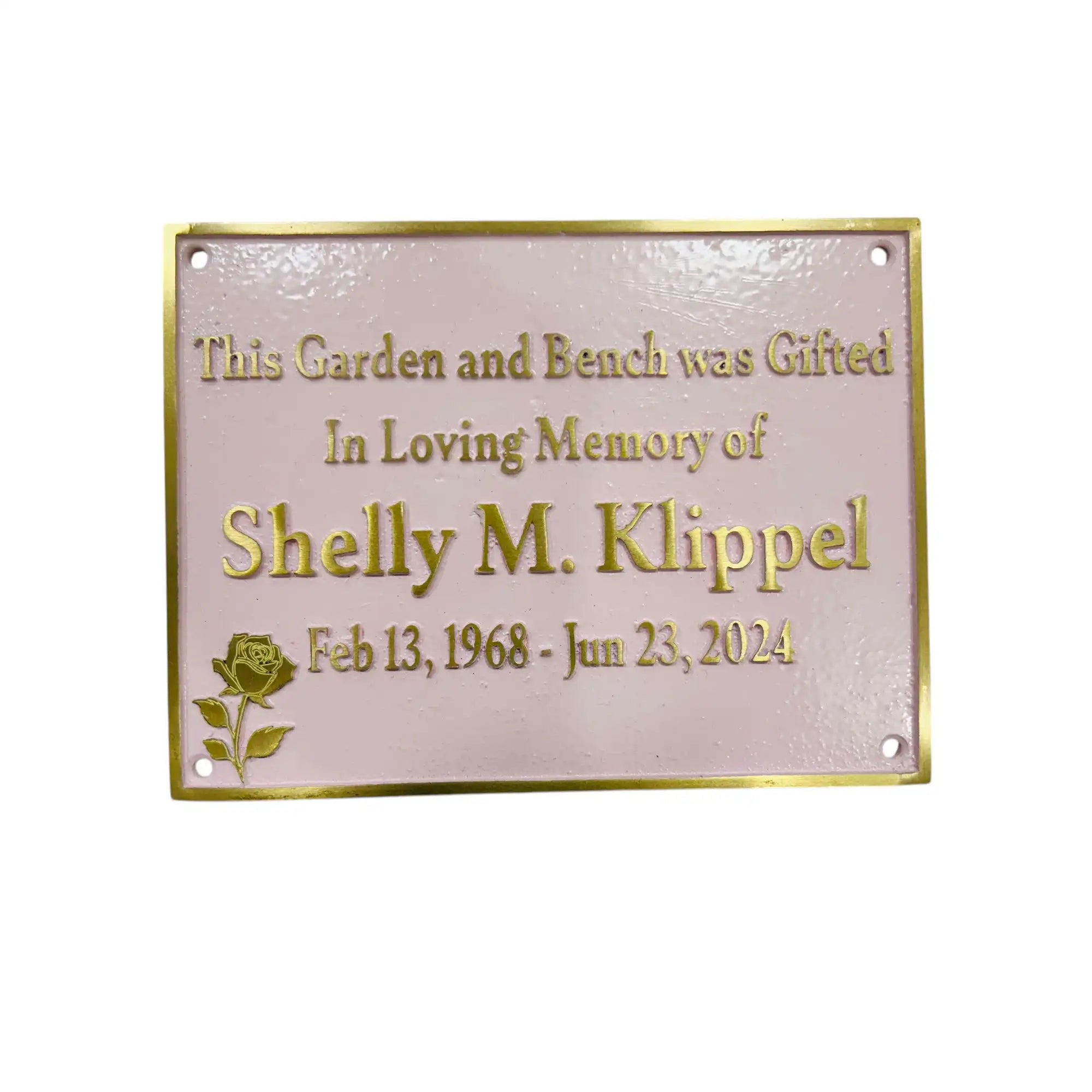 Memorial plaque with engraved text on a white background