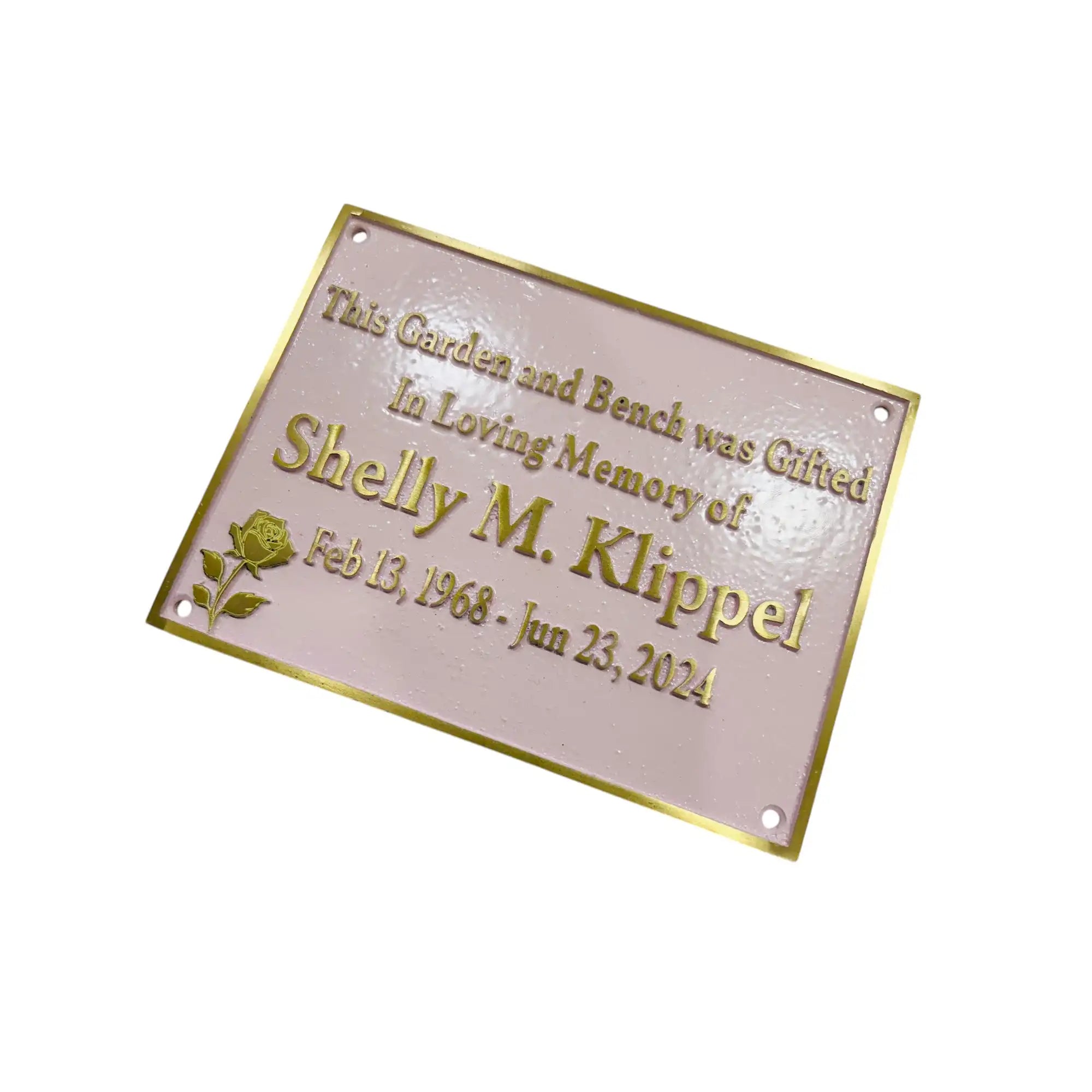 Memorial plaque with engraved text on a white background